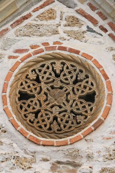 A small rosette on the south gable of the narthex